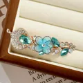 Blue handmade flower hair clip with teal water-drop crystals and white rhinestones - Blue