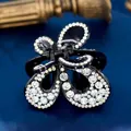 Elegant butterfly hair claw with black acrylic base and sparkling rhinestones - Butterfly White