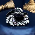 Elegant black acrylic hair claw clip with sparkling rhinestones in a feather pattern - Ocean Flower Multicolor