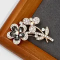 Elegant rose gold dual flower brooch with crystal petals and dark grey gemstones - Graphite Crystal Flower