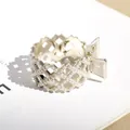 Golden metal hair claw clip featuring elegant inlaid pearls and a hollow geometric design - Pearl Rhombus Style