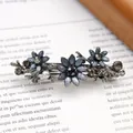 Vintage-Haarklammer in Gunmetal-Schwarz mit dunkelblauen Glitzerblüten und Kristallen - Blaues Gänseblümchen