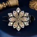 Elegant floral hair claw clip featuring champagne rhinestones on a black base - Periwinkle Yellow