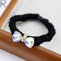 Elegant black elastic hair tie featuring an iridescent crystal bow with gold detail - Crystal Bow Style (5324970472019)
