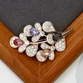 Crystal flower brooch with multi-colored pear-cut crystals on rose gold plating - Multicolor Crystal Leaf
