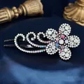 Floral crystal hair claw clip with colorful rhinestones on a dark satin background - Large Pear Flower Multicolor