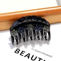 Elegant black acrylic claw clip with blue and grey rhinestone flower decorations - Arc Blue and Gray