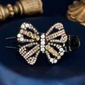 Elegant butterfly hair claw clip with colorful rhinestones on black resin base - Yellow Butterfly Flower
