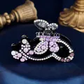 Elegant black butterfly hair claw clip with purple rhinestones on blue silk background - Flower Butterfly Purple
