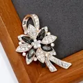 Floral crystal brooch with dark grey gemstone petals and rose gold ribbon detail - Graphite Crystal Fireworks