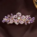Elegant purple crystal flower hair clip with rose gold finish and rhinestone accents - Petal Flower Purple