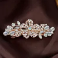 Elegant rose gold flower hair clip with sparkling white crystals and iridescent center stone - Five-Petal Flower White