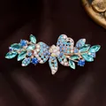 Elegant rose gold butterfly hair clip with blue crystals on dark satin fabric - Blue Bowknot
