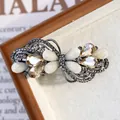 Elegant silver butterfly hair clip with champagne rhinestones and glitter finish - Flower Champagne