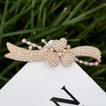 Eleganter Haarclip aus Roségold mit weißen Perlen in Herz- und Kleeblatt-Optik - Perle Nr. 15