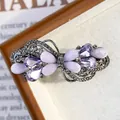 Elegant purple bow-shaped hair clip with sparkling rhinestones on dark metal base - Butterfly Flower Lavender