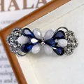 Fermaglio per capelli a fiore con gemme blu e perle su base in lega canna di fucile - Papillon Piccolo Blu Reale