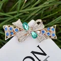 Haarklammer mit Schleifen-Strass und grün-blauen Edelsteinen auf goldener Legierung - Blau Stil 35