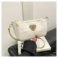 Detailed close-up of fluffy white fleece small square bag with leather logo patch - With Pendant / White