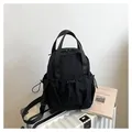 Versatile black pleated nylon backpack on luggage, spacious lightweight travel rucksack - One Size / Black