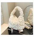 Close-up of white pleated handbag with elegant satin ruffles and soft texture details - One Size / White