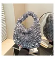 Detail of silver grey pleated satin handbag featuring elegant ruffle craftsmanship - One Size / Gray