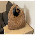 Detail of cross-woven paper rope texture and inner lining of the large straw tote bag - One Size / Khaki