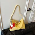 Yellow pebbled leather slouchy shoulder bag with cute red elephant charm accessory - With Elephant Pendant / Yellow