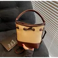 Beige canvas and brown leather bucket bag with top handle and adjustable shoulder strap - One Size / Khaki