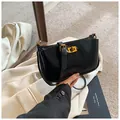 Retro black glossy leather shoulder bag featuring a classic gold twist lock and adjustable strap - One Size / Black