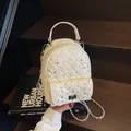 Mini beige quilted backpack with rhinestone accents and silver chain strap details - One Size / Off White