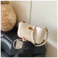 Chic cream-colored leather shoulder bag with vintage gold buckle and adjustable strap - One Size / White