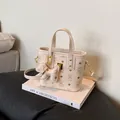 Creamy mini tote bag with cartoon bear print and matching leather bear charm - Single Bag / Off White