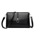 Elegant black lychee grain leather handbag with silver ring buckle and detachable strap - Black