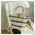Handwoven bucket bag in cream and navy stripes with drawstring inner pouch and long strap - Blue