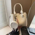 Chic beige bucket bag in lychee pattern leather with a round coin purse pendant - No Pendant / White
