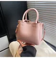 Pale pink faux leather bucket bag with dual handles and detachable shoulder strap - No Pendant / Silver