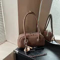 Brown leather bowling bag with extended handles and baseball bat pendant detail - No Pendant / Coffee With Charms