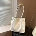 Chic creamy white glossy leather tote bag with slender straps and a soft textured finish - No Pendant / White