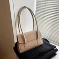 Minimalist beige leather shoulder bag with embossed letters and a curved flap design - No Pendant / Khaki