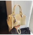 Light yellow Boston handbag in smooth faux leather with a heart charm and strap - With Heart Charm / Light Yellow