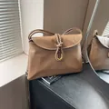 Classic brown crossbody bag featuring woven knot detail and U-shaped gold hardware - Large / Khaki