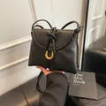 Chic black crossbody bag featuring a unique gold U-shaped hardware and braided strap detail - S / Black