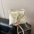Classic cream crossbody bag featuring a woven strap detail and gold U-shaped buckle - S / White
