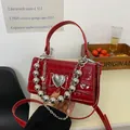 Mini red crocodile embossed handbag with silver heart buckle and metal ball chain decoration - Red