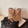 Classic caramel brown leather crossbody bag with woven detail and gold horseshoe buckle - S / Khaki