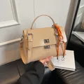 Beige soft leather messenger bag with top handle and orange braided rope charm - With Pendant / Apricot