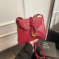 Classic red leather shoulder bag with woven knot detail and gold U-shaped buckle - S / Red