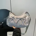 Light gray nylon crossbody bag with bow drawstring details and adjustable strap - One Size / Gray