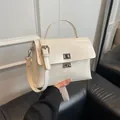 Chic beige crossbody bag with silver twist lock and adjustable strap for daily use - No Pendant / White